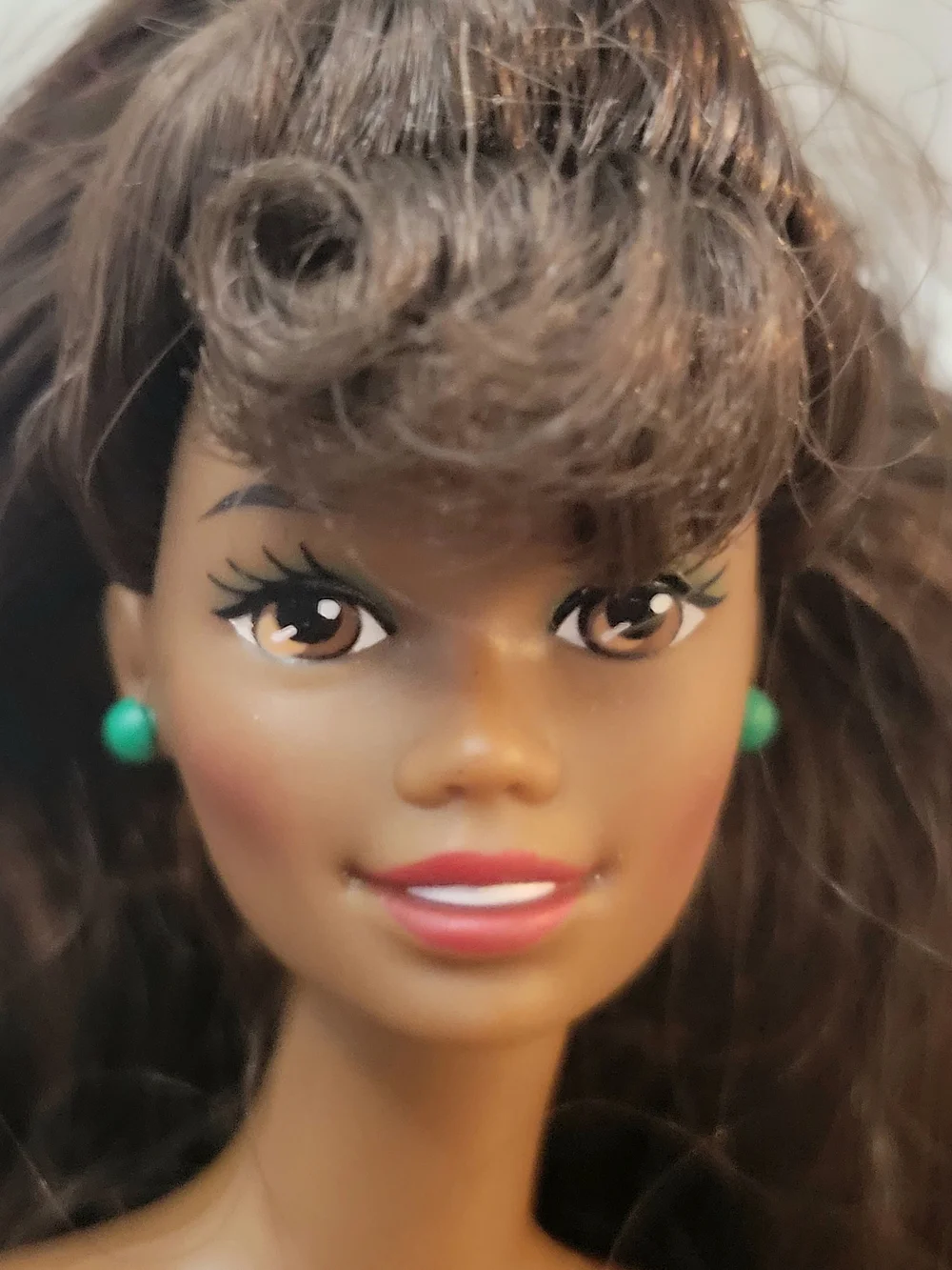 Brunette Doll with Green Stud Earrings and White Turtleneck